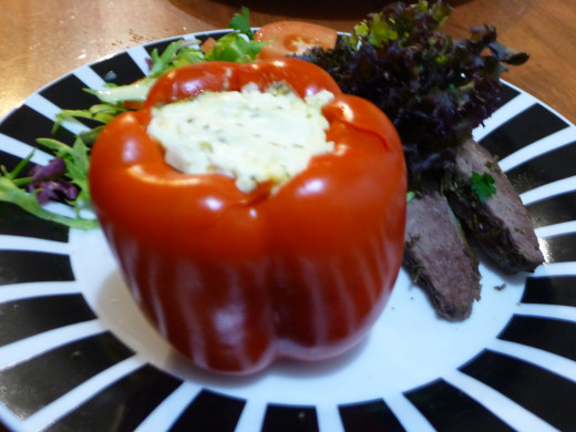 A different angle of the stuffed capsicum with lamb and salad.