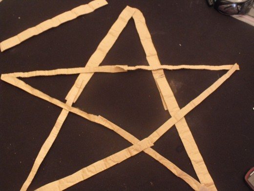 Cut strips, form a 5 point star and glue together.