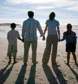 A beautiful family photo that represents the family and their personalities. It makes you feel they love the beach and makes you feel warm and lovely looking at it. 