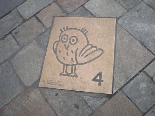 A variation on the bronze tile, with the owl still instead of flying.