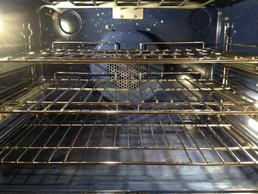 To use the automatic feature to clean oven, shelves and vertical wall racks must be lifted out. 