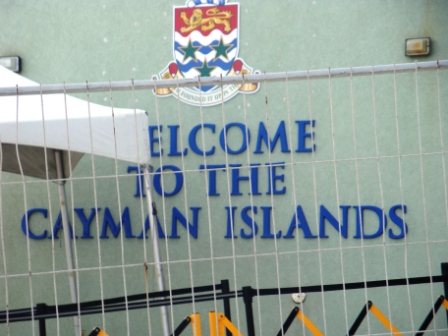 A Welcome To The Cayman Island. This sign was actually hidden from view. I had to go around a barricade to take this snap.  Image Is Property of ComfortB. Use by permission only.