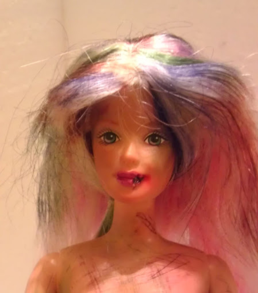 Uh oh! Barbie's lip must have gotten caught while she was chewing on something. And her new zombie 'do is perfect.