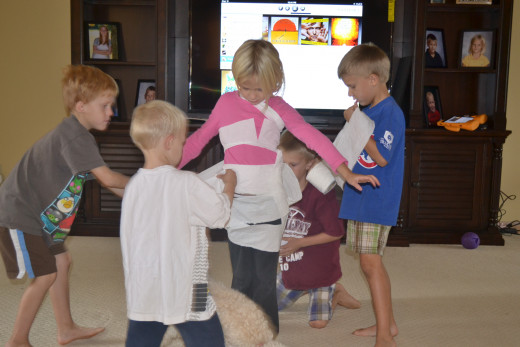 The boys had fun wrapping up their sister with toilet paper and turning her into a mummy
