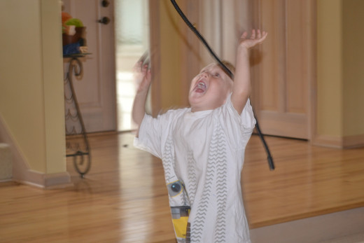 Son taking on a battle with a rope during the talent show