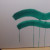 Using Green Acrylic paint to start to paint some curvy serpent shapes.