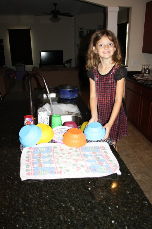 My littlest girl helping with dishes.