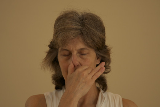 Block the right nostril with the right thumb. Exhale through the left nostril.  then inhale through the left nostril.