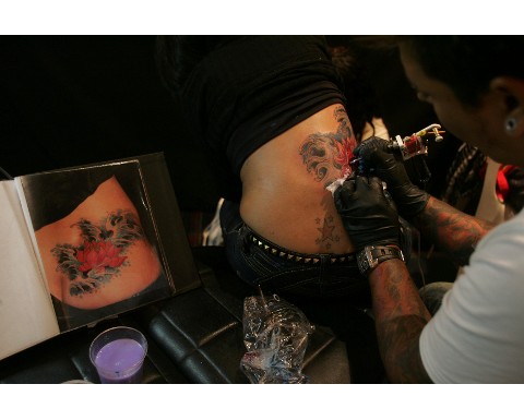 Woman Has Some Excellent Looking Tattoo Work Done By A Tattoo Artist