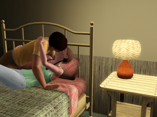 This Sims 3 couple is making out.