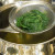 Draining cooked spinach Draining cooked spinach