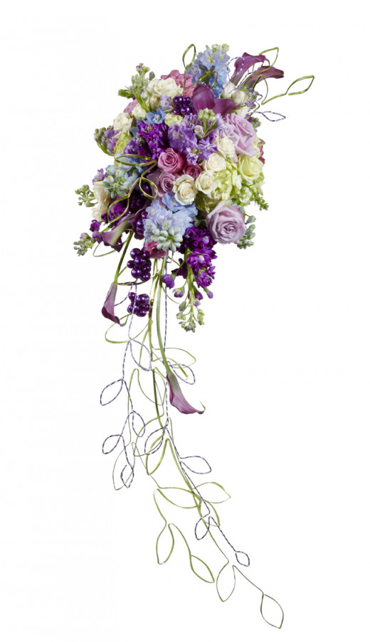 The trails on this cascade bouquet are almost entirely made from wide metallic wire, giving this bouquet a thoroughly 21st century look. These are fresh flowers, but there is no reason you couldn't do the same with silk. 