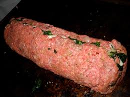 Roll up the meat into a jelly roll or log.  Slice before or after cooking.