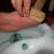 Gently brush off dead skin from feet Gently brush off dead skin from feet