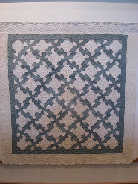 Traditional pattern known as "Drunkard's Path", completed in 1900 by unknown Amish crafters. Exhibited in the Charles Hotel, Cambridge, Massachusetts.  