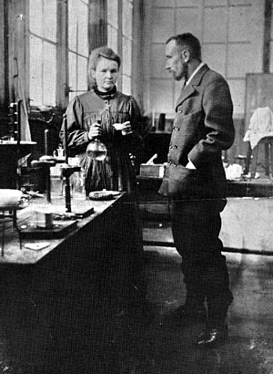 Marie and Pierre Curie working together in the lab.
