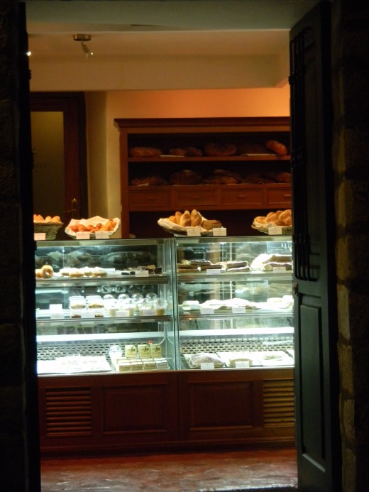 You are greeted with a display of desserts and bread.