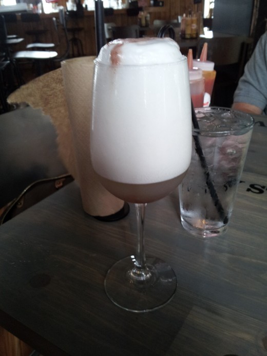 Blueberry Foam--a champagne cocktail at Bowery, a gourmet hot dog restaurant in Dallas, Texas