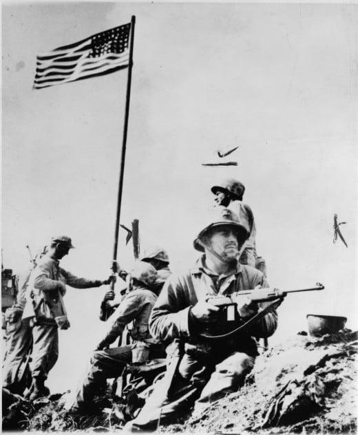 First flag raised over Mt. Suribachi (23 February 1945).  