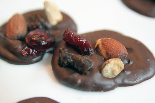 Chocolate candies topped with pistachios, raisins, almonds, and orange. Click for the recipe.