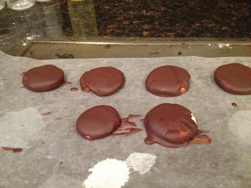 Dip the peppermint patties into the chocolate and place on waxed paper to cool.