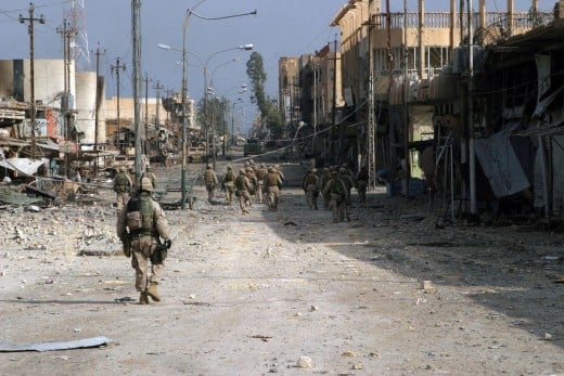 Fallujah, Iraq (Nov. 15, 2004) - Iraqi Special Forces Soldiers assigned to the U.S. Marines of 2nd Squad, 3rd Platoon, L Company, 3rd Battalion, 5th Marine Regiment, 1st Marine Division, patrol south clearing every house on their way through Fallujah