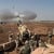 An M-198 155mm Howitzer of the US Marines firing at Fallujah, Iraq, during the Second Battle of Fallujah.