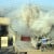 A US Marine Corps (USMC) Marine M1A1 Abrams Main Battle Tank (MBT), 2nd Tank Battalion (BN), fires its main gun into a building to provide suppressive counter fire against insurgents who fired on other USMC Marines during a fire fight in Fallujah, Al