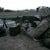 A U.S. Marine from Weapons Platoon, Company E, 2nd Battalion, 1st Marine Regiment, 1st Marine Division, mans an M240G machine gun at the Highway 1 "cloverleaf" outside the city of Fallujah, Iraq, April 5, 2004. U.S. Marines islolated the city after t