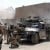 U.S. Marines with Company A, 1st Battalion, 5th Marine Regiment, fire against terrorists operating in Fallujah, Iraq April 7, 2004. U.S. Marines suspended offensive operations after isolating and systematically clearing portions of the city.