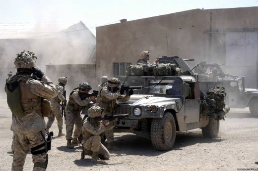 U.S. Marines with Company A, 1st Battalion, 5th Marine Regiment, fire against terrorists operating in Fallujah, Iraq April 7, 2004. U.S. Marines suspended offensive operations after isolating and systematically clearing portions of the city.