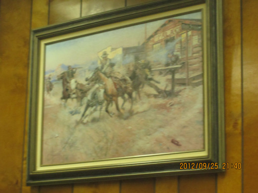 'Smoke of a 0.44' by Charles Russell, a print in my brother's office.