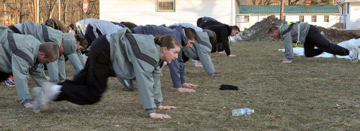 National Guard recruits doing mountain climbers.