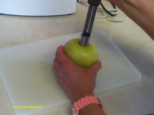 Apple corer in center of apple