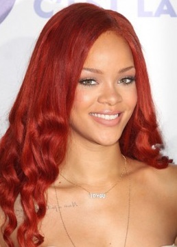 Rihanna with long, wavy red hair