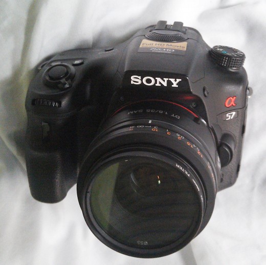 Sony A57 camera body fitted with a DT 1.8/35mm SAM lens.  The grip and body style make it a nice camera to hold and control with the various buttons and dials.