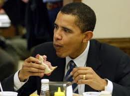 Barry Obama enjoys a good sandwich. You suppose it has elephant meat?