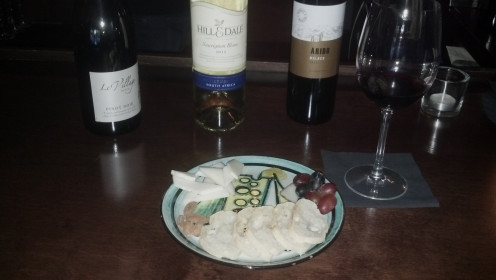 A selection of three wines to taste and an assortment of bread, cheese, grapes, and nuts for $7- what a deal! 