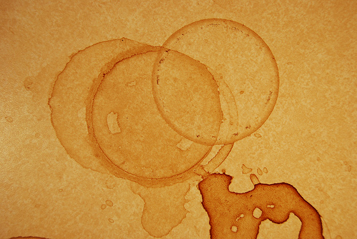 Coffee stains on tablecloth.