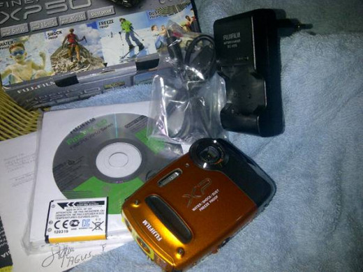 PX 50 comes with rechargeable battery, Battery charger, USB cable, CD Rom operation software, functional strap, and manual book.
