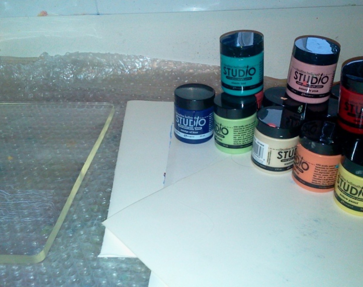Scrap paper and Studio paints at the ready. You can see the gel plate on the left.