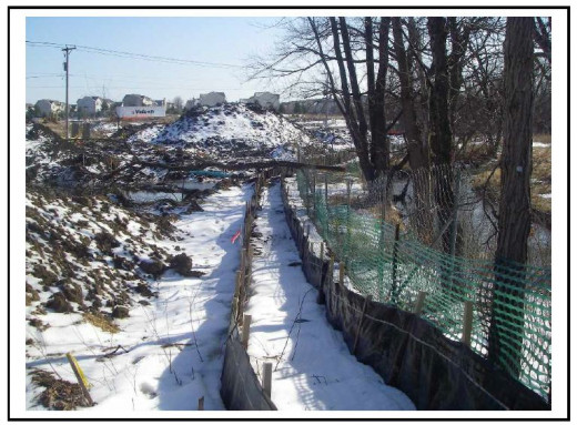 Silt Fencing helps protect an adjacent creek and low-lying area from any soil contamination or runoff from the construction site.