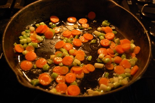 Place onions and carrots in skillet