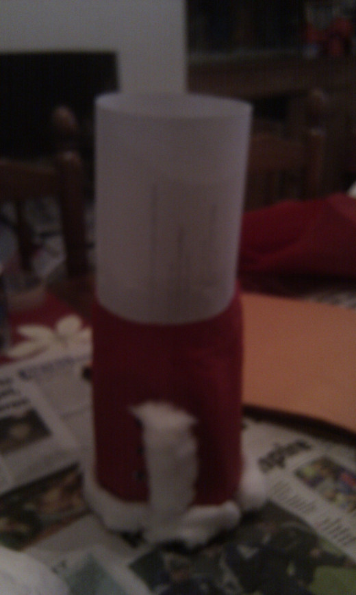 Stick a cylinder of card to make the head