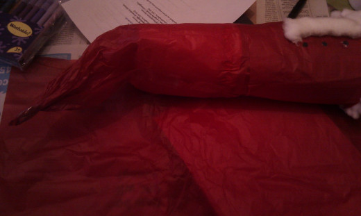 Completely cover in red crepe paper