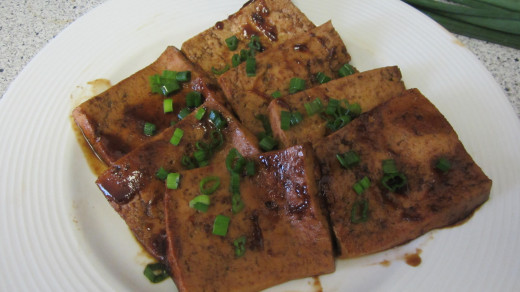 Fried tofu in a carmelized shoyu sauce with green onions.  