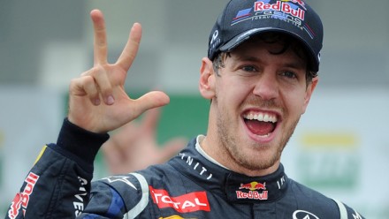 Sebastian Vettel signifying win number 3 in 2012
