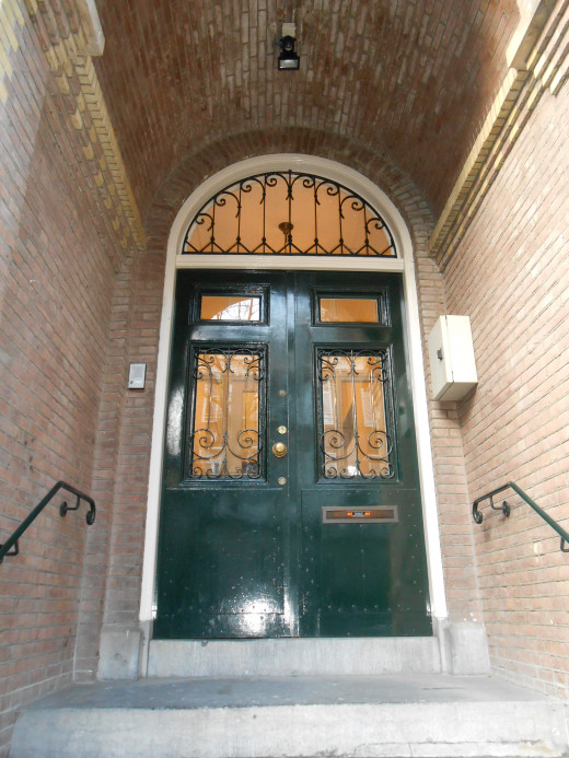 A typical doorway in Amsterdam with an overhang to keep out of the weather.