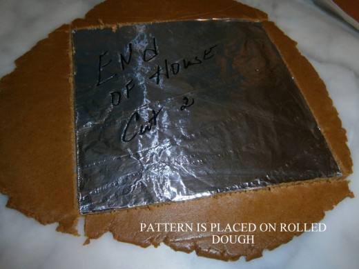 The Pattern is placed on the rolled out dough and cut with a  knife