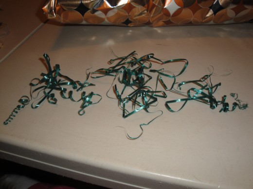 cut slits in the edges of the ribbon, and pull apart to make many strings. 